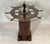 Quality eight spoke varnished ships wheel that is mounted to an authentic ships binnacle base. Both have been...