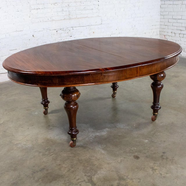 Marvelous 19th Century antique William IV style oval dining table composed of a mahogany frame with straight turned legs...