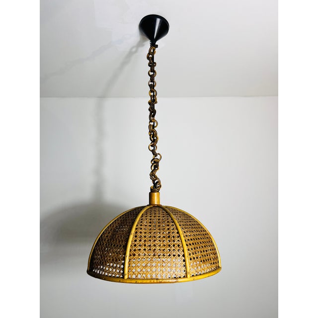 This vintage pendant lamp from 1960s Italy is a beautiful example of natural craftsmanship and timeless elegance. Made...