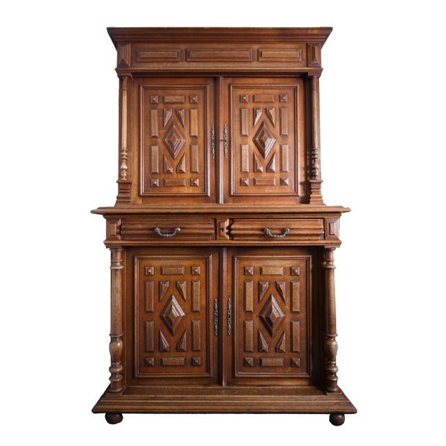 Representative two-part cabinet made in Belgium around 1920 in the neo-Renaissance style. The high-quality construction of...