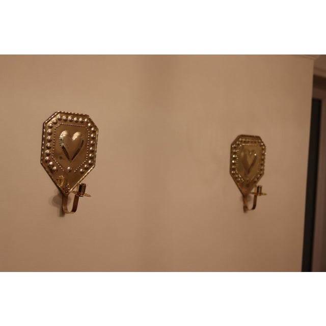 Made in Sweden. Beautifully handcrafted Swedish wall sconces, made from hammered brass plate, Featuring, these sconces...
