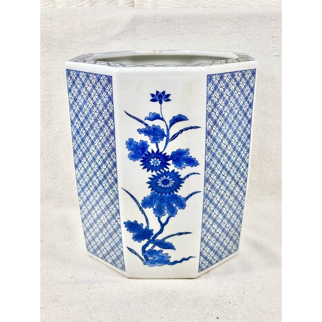 Beautiful vintage blue and white cache pot. Chinoiserie floral design. Perfect to use with a plant or faux florals. This...