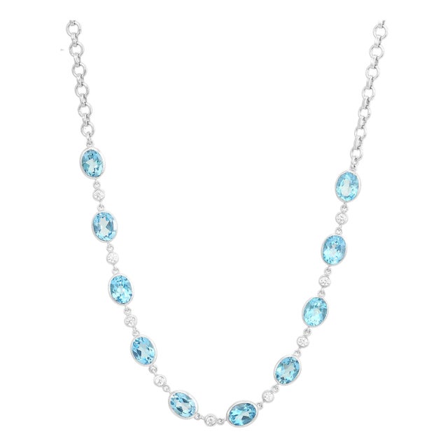 Oval Cut Blue Topaz Station Necklace With Curb Link Chain For Sale