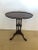 A particularly lovely oval small crotch mahogany side or drinks table having cut out periphery and tripod slipper paw feet.