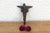 A robust utilitarian antiquity featuring a detailed geometric stem and a stylized architectural bud finial, carrying a...