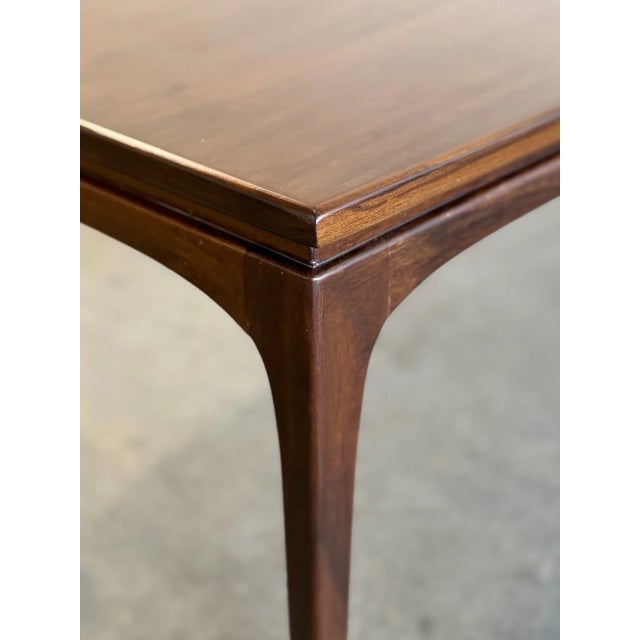 W66 D18 H14.75 Professionally refinished, this vintage coffee table has been restored to highlight the natural beauty of...