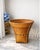 A striking handwoven Southeast Asian basket distinguished by its sculptural flared silhouette and beautifully braided...