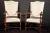 Pair of elegant Italian 19th century walnut finely carved armchairs with a white striped upholstery. Measures: 130 x 60 x 50.