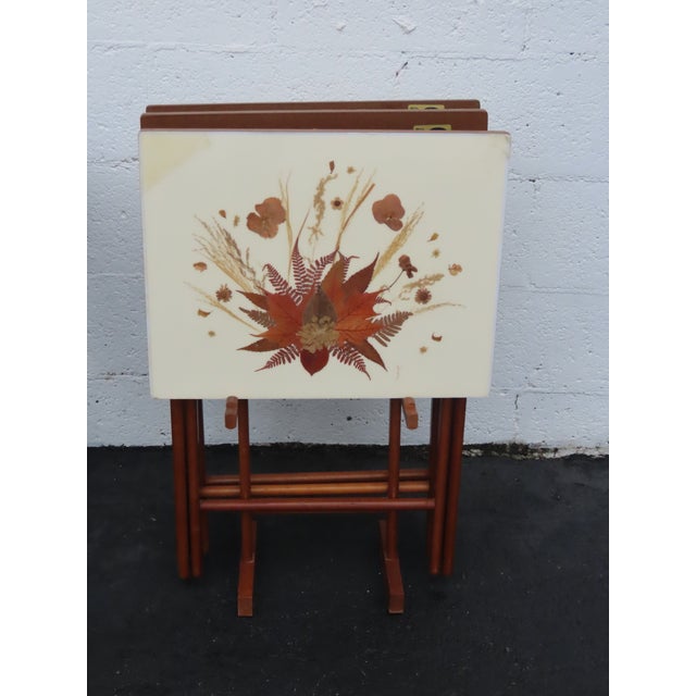 This high quality Set of 4 Folding Trays is made out of wood, veneer, dried flowers, and clear topcoat. This lovely set...