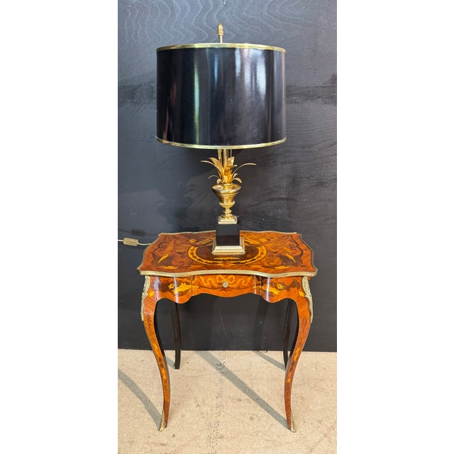 A lovely little French Lamp Table with a drawer to front. Adorned with Marquetry and having ormolu mounts and feet. In...