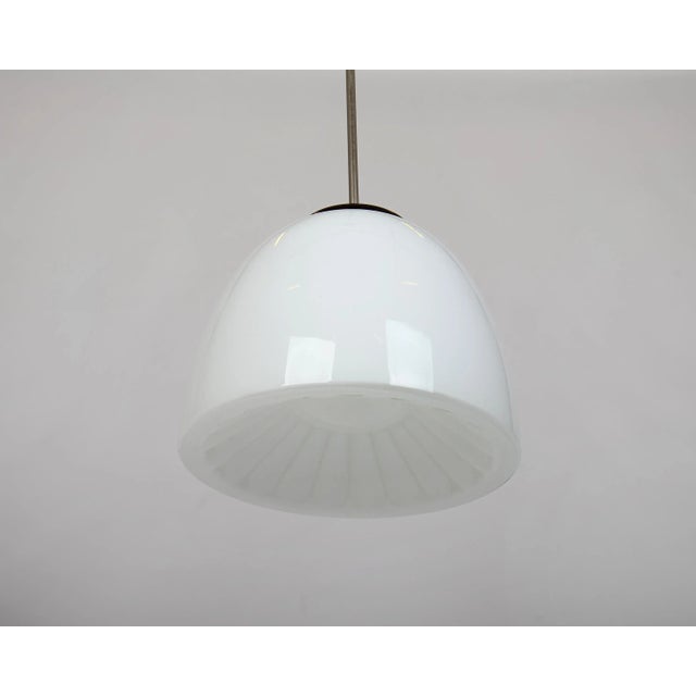 Vintage 1950's school light. Nickel plated metal stick, bakelite parts, E27 light bulb, opal glass ball. The original...