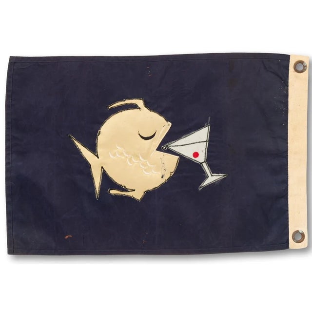 Sz: 11 1/2"H x 17 1/2"W Nylon flag w/ cotton headers & brass grommets. Appliqué details and stitched red cherry. c1960’s