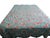 This 1930s Jadeite feedsack yo-yo quilt showcases intricate craftsmanship with a delicate trellis pattern and vibrant...