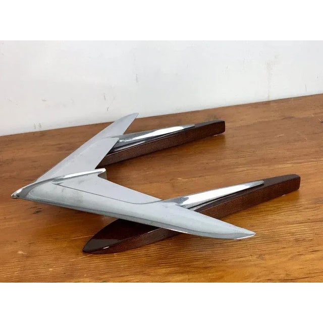 Art Moderne airplane sculpture, 1950s, raised on a French polished mahogany base.
