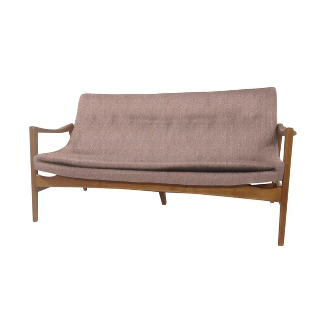 Custom made Mid-century-style sofa. The sofa was made in the style of Ib Kofod-Larsen. The sofa is stained a light walnut,...