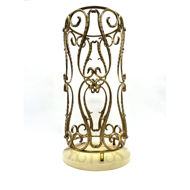 This elegant umbrella stand in the distinctive Hollywood Regency style is a luxurious statement piece for any entryway....