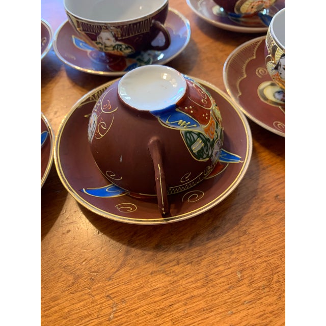 Mid century Japanese Dragonware tea set. Includes teapot , sugar and cream with eight cup and saucers. In Kutani moriage...