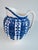This antique English piece has a blue and white pattern with alternating blue and off white ground stylized floral...
