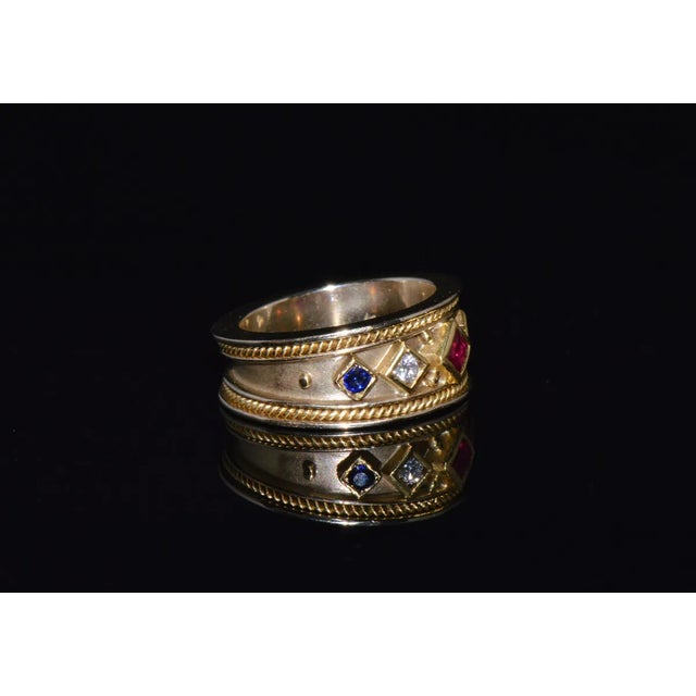 This is a gorgeous 18k solid gold ruby, sapphire and diamond Etruscan beaded eternity band ring. This finely crafted 18k...