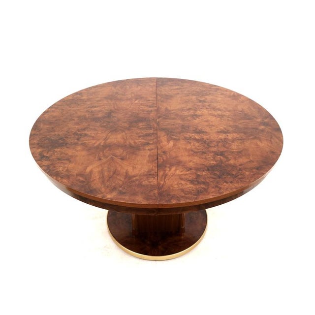 Stylish round vintage design extendable Art Deco Dining Table. Combine elegance and functionality with this round...