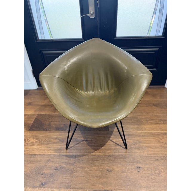 An iconic original Knoll Diamond Chair designed by legendary modernist Harry Bertoia, featuring its original olive green...
