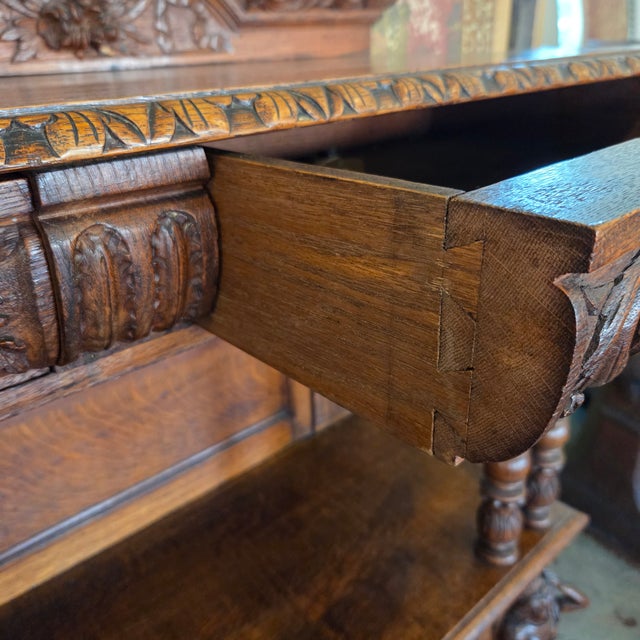 This beautiful antique heavily carved server/buffet/sideboard is a work of art and would be a perfect accent piece in any...