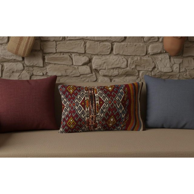 Add a touch of history and warmth to your space with this vintage handmade Turkish wool kilim cushion cover. Crafted from...