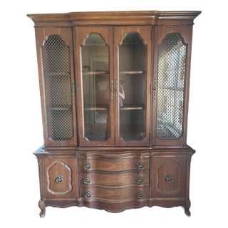 Mid 20th Century French Provincial Style China Cabinet — 2-Piece, Brass Lattice Doors, Serpentine Base For Sale
