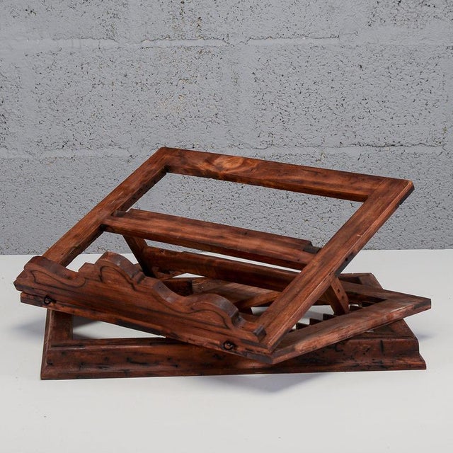 This antique tabletop lectern, crafted from solid wood and dating from the late 19th century, embodies the timeless charm...