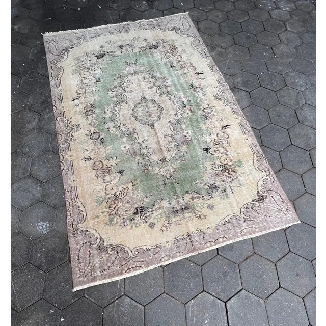 Beautiful short pile Yuruk rug in the colors cream, beige and light blue. The rug comes from Turkey and dates from the...