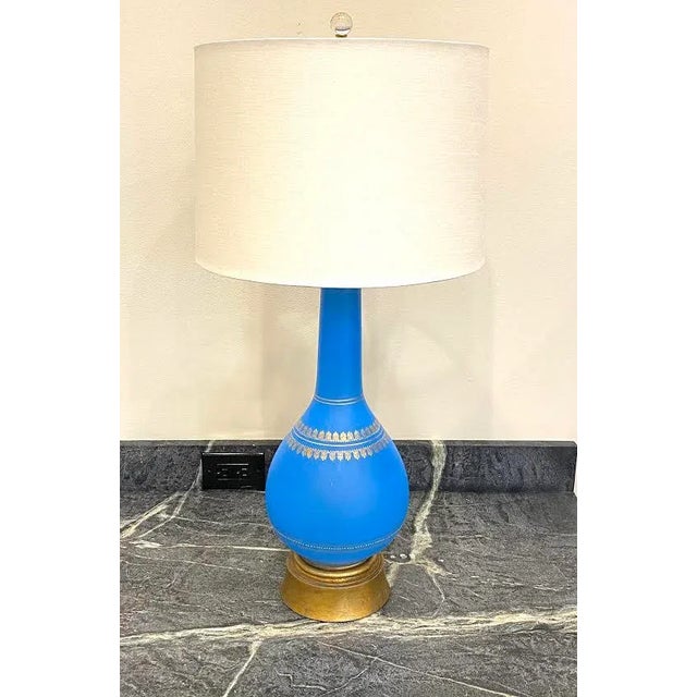 This is a beautiful vintage glass table lamp. The lamp is made of striking bright blue glass and features hand painted...