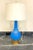This is a beautiful vintage glass table lamp. The lamp is made of striking bright blue glass and features hand painted...