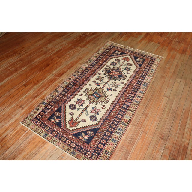 early 20th-century tribal heriz small runner. An ivory field with a tribal geometric pattern throughout Size: 2'11” x 5'11''