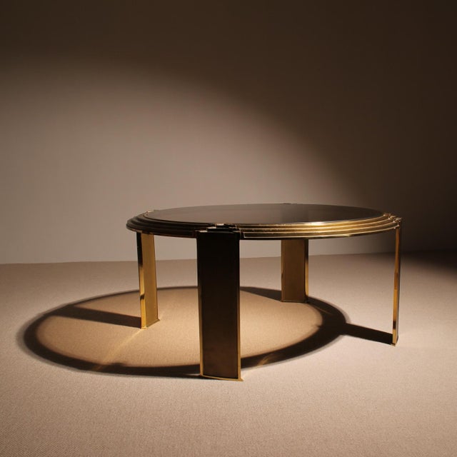 Elegant and expressive round coffee table from the Netherlands dating back to the 1970s. This extravagant piece of...
