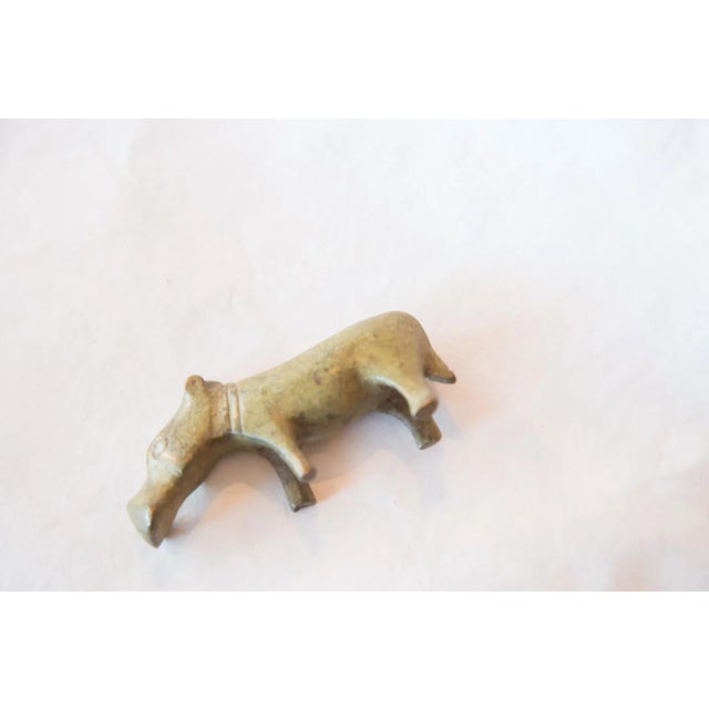 :: Vintage circa mid 20th century African bronze or brass casting sculpture of a hippo with a large snout and simple but...