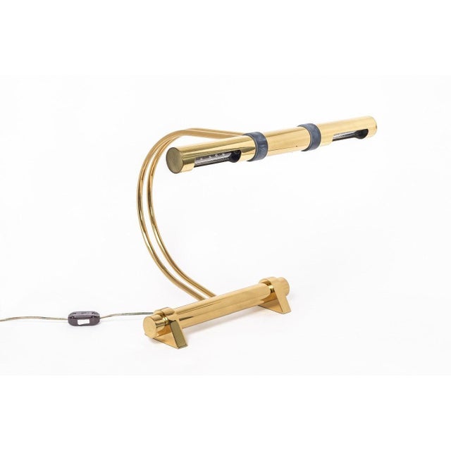 This exceptional Casella Lighting modernist polished brass table lamp circa 1970 features two sockets with tubular shades...