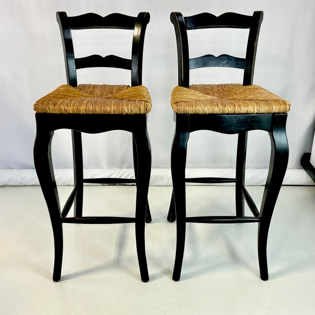 We love the casual and yet chic charm of a Ladderback chair with rush seats. This is a pair of barstools from the 1980s...