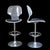 A pair of lucite and chrome bar stools for Hill Manufacturing, with clear acrylic frames and gleaming chrome accents. The...