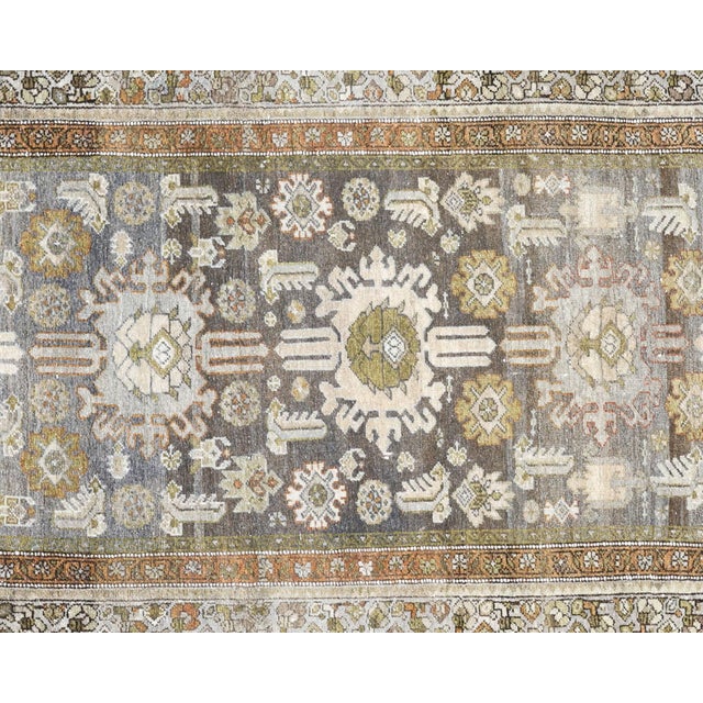 This semi-antique Persian Melayer runner originates from Iran's Hamadan weaving region, where artisans have practiced...