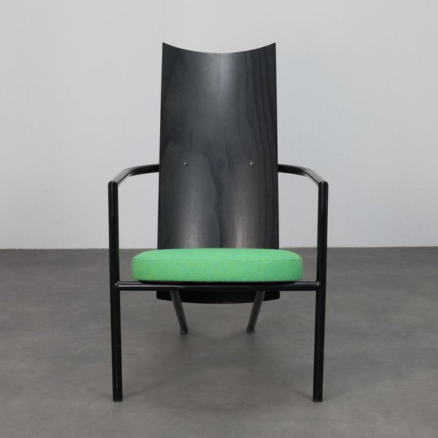 A striking pair of postmodern armchairs from the 1980s, defined by their sculptural silhouette and sharp, architectural...