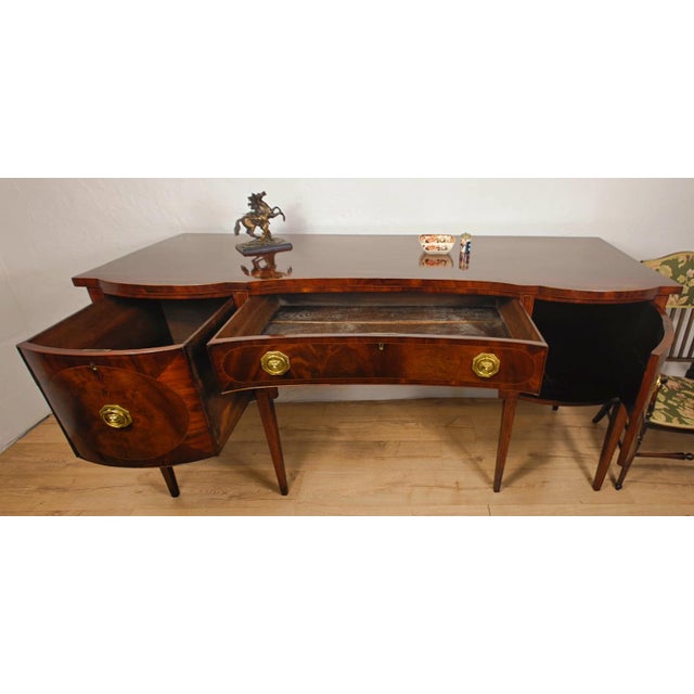 This is a wonderful Large Georgian Sideboard with many classic antique featuring that would impress in the living or...