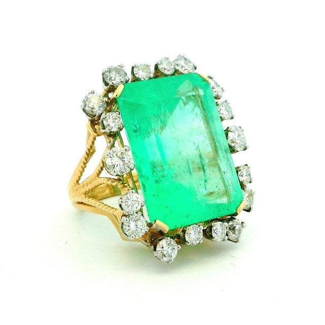 An extraordinary vintage statement ring from the 1960s, showcasing a magnificent Colombian emerald weighing approximately...
