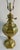 Distinctive vintage brass table lamp featuring an unusual faceted, bulbous body richly decorated with engraved and chased-...