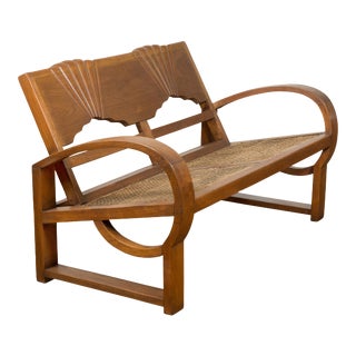 Teak Wood Country Outdoor Bench from Madura with Rattan Seat and Looping Arms For Sale