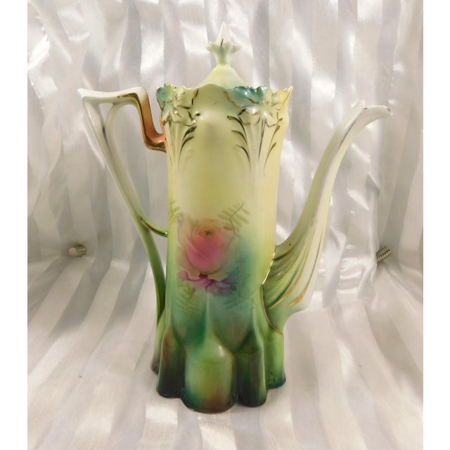 This is an unmarked chocolate pot that looks like it might be a Reinhold Schlegelmilch-or maybe not. The chocolate pot is...