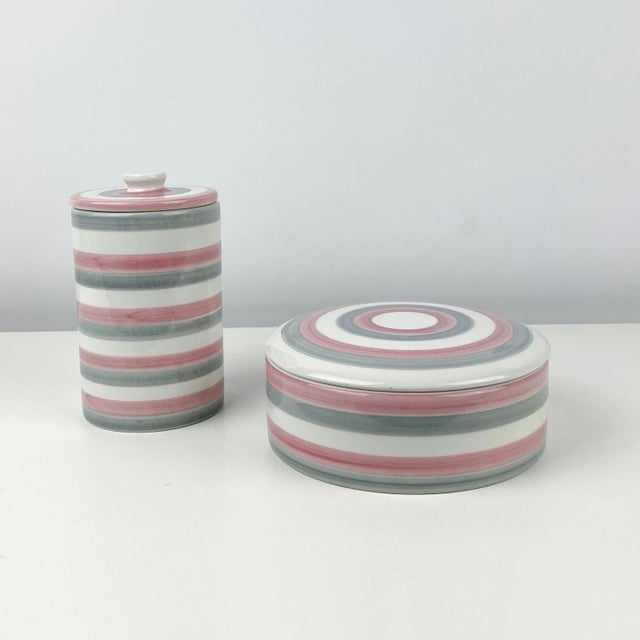 Vintage circa 1970s ceramic canisters/containers. White, pink and gray bullseye stripe glazed. Matching lids and marked...