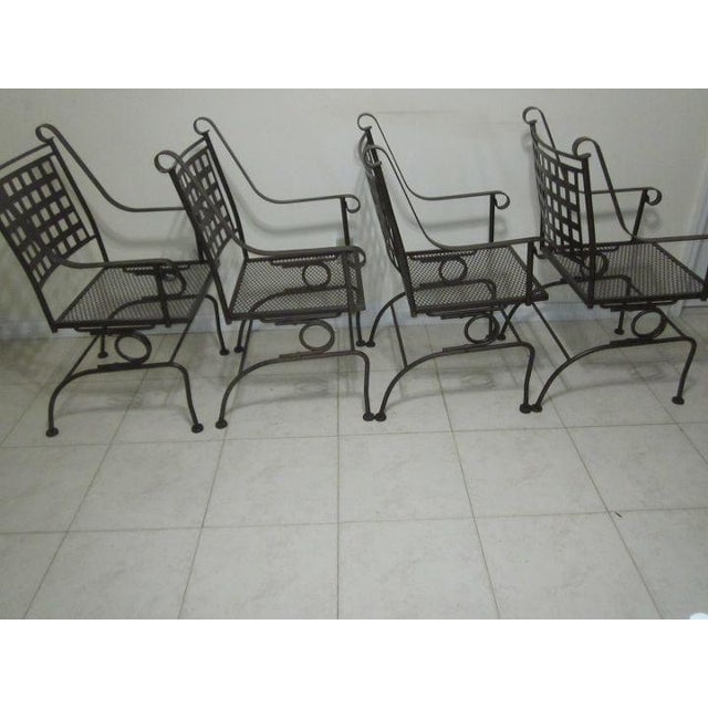 Make your outdoor space more inviting with this set of four black patio recliners. These chairs feature a unique sculpture...