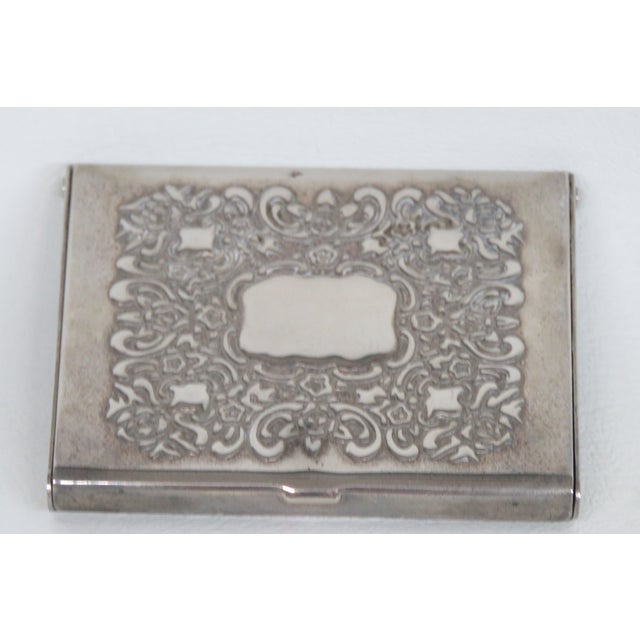 This gorgeous vintage Photo or Card Holder is silver plated. Made by Godinger, this compact pocket-sized album presents a...