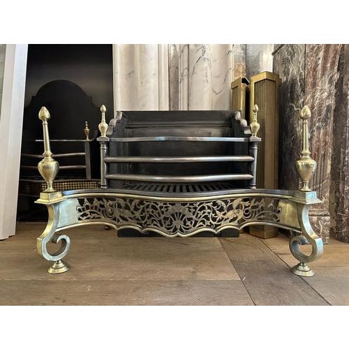 A large and very good quality Regency style fire grate from the later part of the 19th century. The steel bowed bars with...