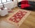"Enhance the ambiance of your home with this magnificent Persian-influenced Turkish hand-knotted rug made by skilled...